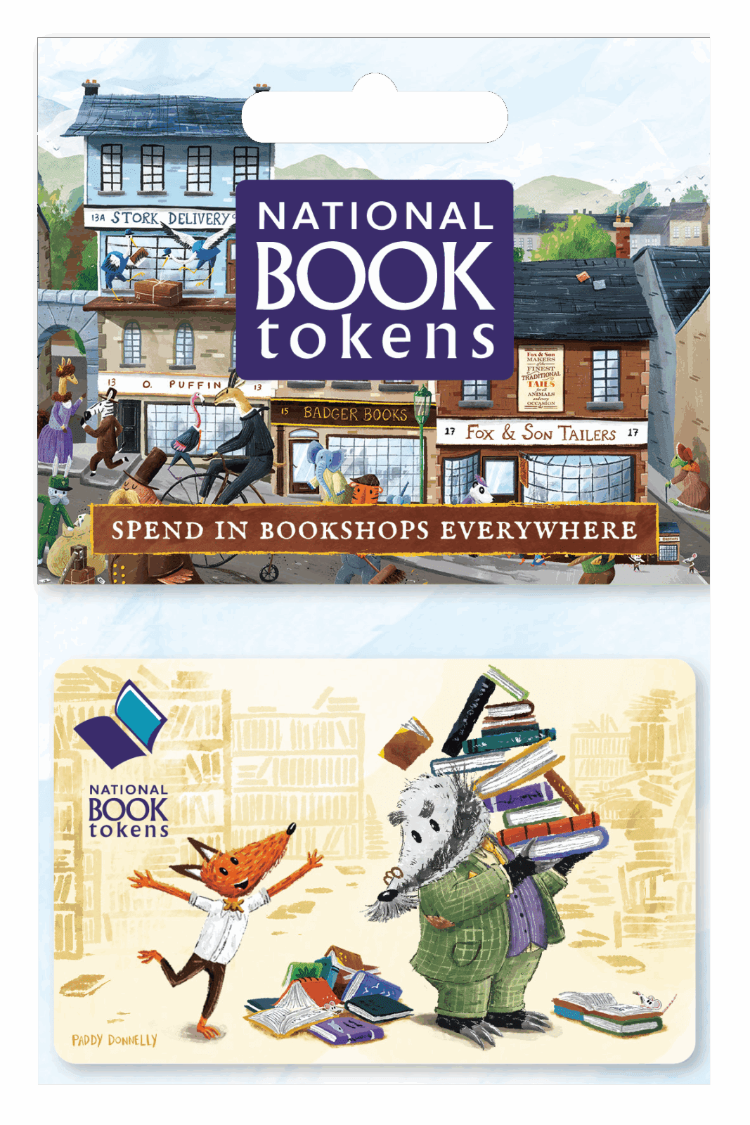 Illustrated gift card showing animals carrying books in a whimsical village scene, with shops labelled "Stork Delivery," "Badger Books," and "Fox & Son Tailers." The card logo reads "National Book Tokens," with the text "Spend in Bookshops Everywhere."